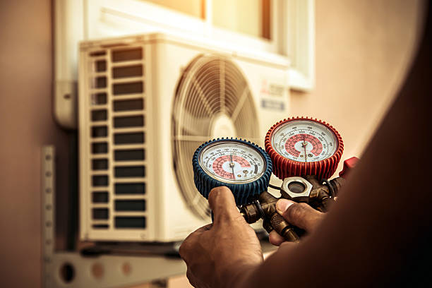 Professional Heat Pump Repair technician working in Pelham, AL
